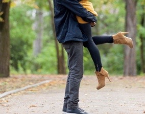 woman running into mans arms.
